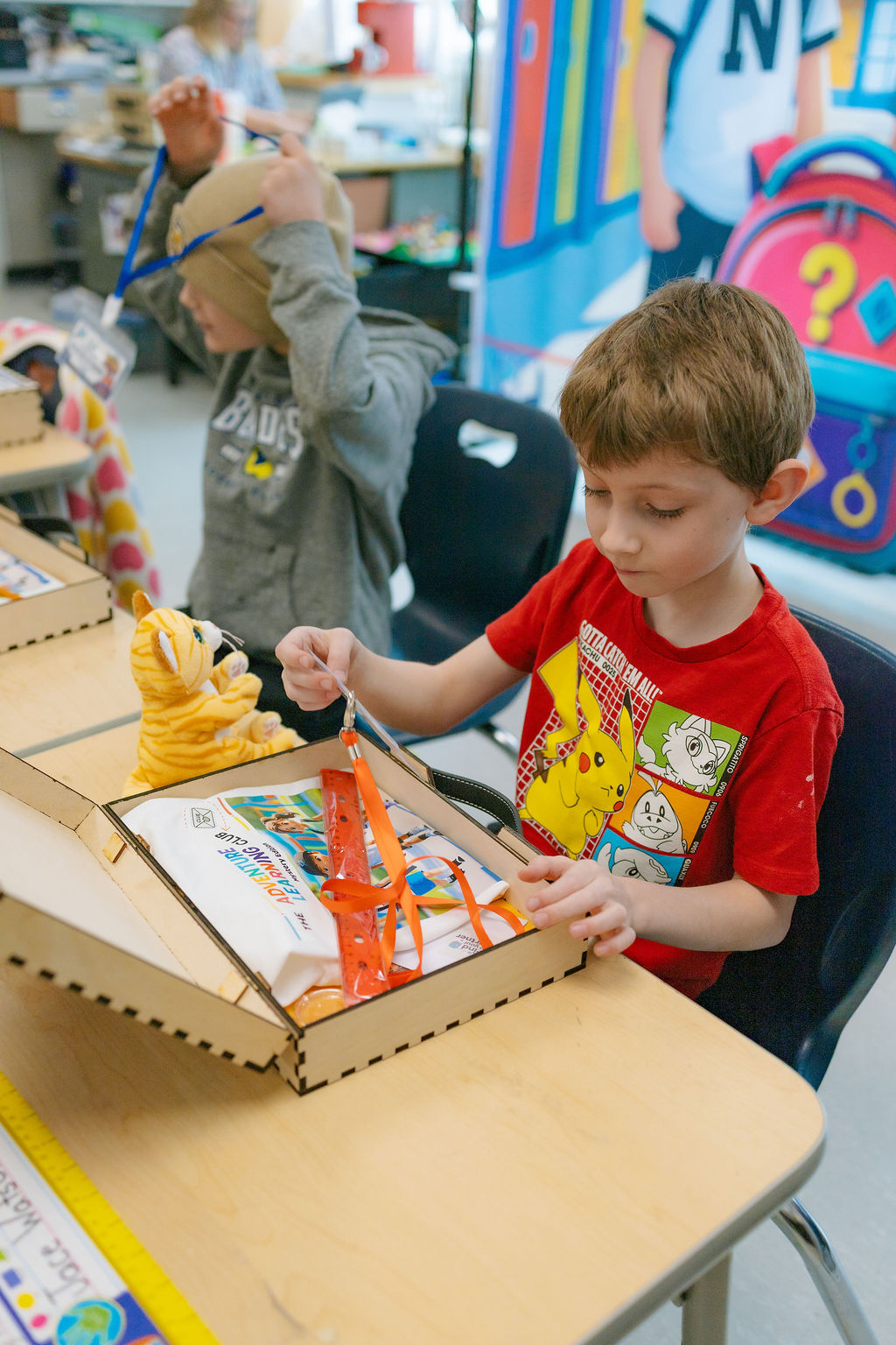 Child unboxing the Adventure Learning Club kit